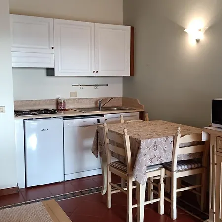 Апартаменты Localita Cala Del Faro. Affitto Bilocale Con Portico E Giardino. Порто-Черво
